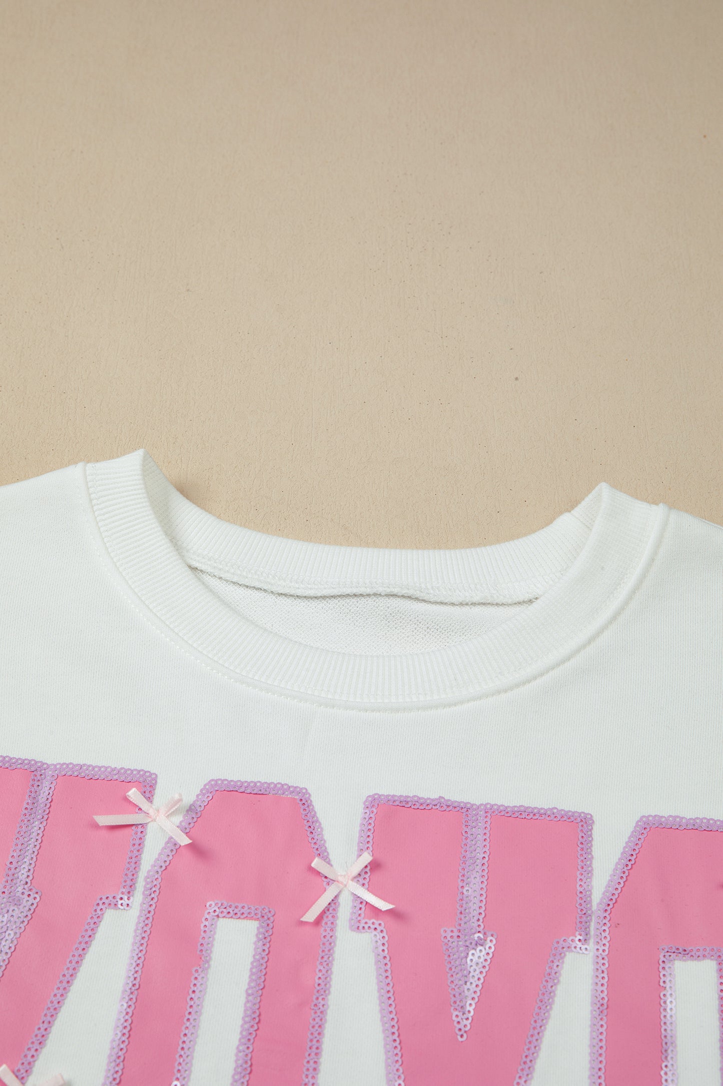 White Bow Sequin XOXO Letter Graphic Exposed Seam Baggy Sweatshirt