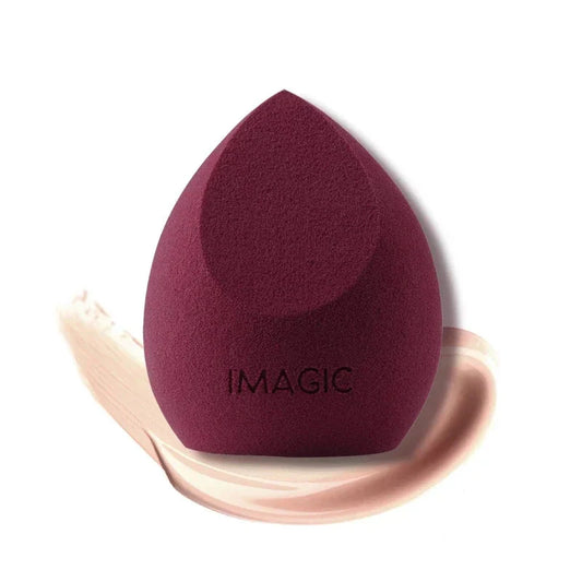 Maroon makeup sponge with 'IMAGIC' branding on a white background